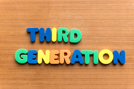 third generation colorful word on the wooden backgroundの写真素材
