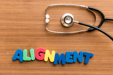 Alignment  colorful word on the wooden background with stethoscopeの写真素材