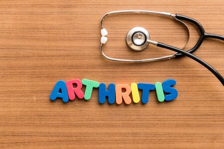 arthritis  colorful word on the wooden background with stethoscopeの写真素材