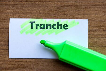 tranche word highlighted on the white paperの写真素材