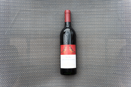 Bottle of red wine and glass on wooden backgroundのeditorial素材