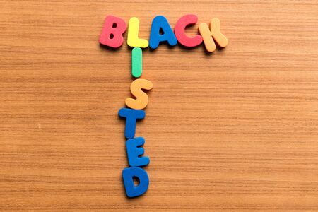 black listed colorful word on the wooden backgroundの写真素材