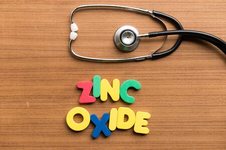 zinc oxide colorful word with stethoscope on wooden backgroundの写真素材