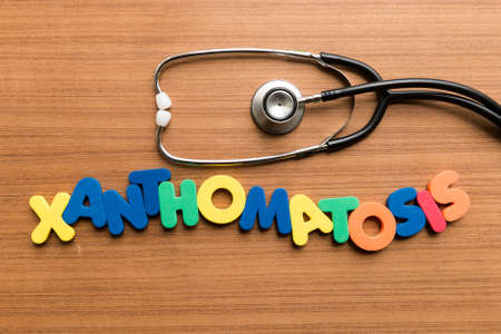 xanthomatosis colorful word with stethoscope on wooden backgroundの写真素材