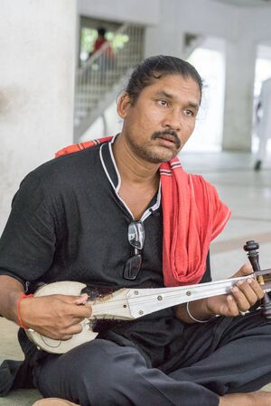Kushtia, Bangladesh - May 19, 2016: One black dressed singer is singing at kushtia, bangladeshのeditorial素材