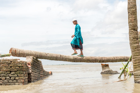 Dohar, Bangladesh - August 5, 2016: Heavy flooding from monsoon rain and tide from river in Dohar, Bangladesh on August 5, 2016のeditorial素材