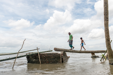 Dohar, Bangladesh - August 5, 2016: Heavy flooding from monsoon rain and tide from river in Dohar, Bangladesh on August 5, 2016Dohar, Bangladesh - August 5, 2016: Heavy flooding from monsoon rain and tide from river in Dohar, Bangladesh on August 5, 2016のeditorial素材