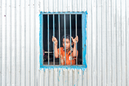 Dohar, Bangladesh - August 5, 2016: child are looking through window in Dohar, Bangladesh on August 5, 2016のeditorial素材
