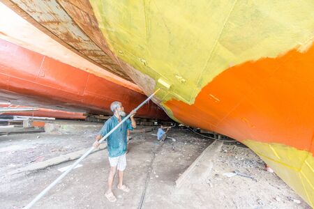 DHAKA, BANGLADESH - August 12: Local workers are working to repair ships in dockyard on August, 12, 2016 in Dhaka, Bangladeshのeditorial素材
