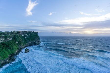 Uluwatu temple in the sea in Bali Indonesiaの写真素材