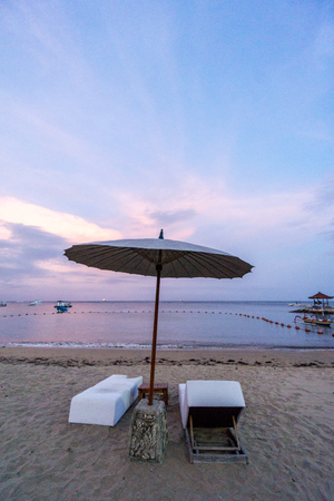 sea Beach with chair during sunset in bali , indonesiaの写真素材