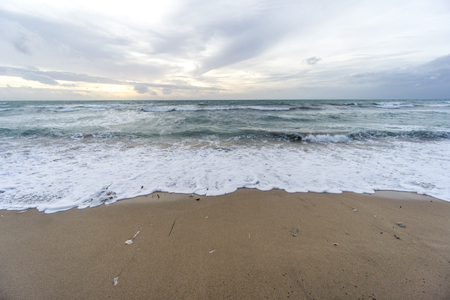 Sunset over sand at bali, indonesiaの写真素材
