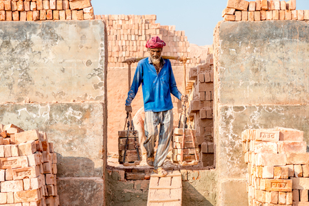 Dhaka, Bangladesh - January 21, 2017: Workers are working in Brick Field at Amin bazar, dhaka, Bangladesh.のeditorial素材