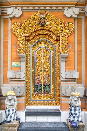 The traditional wood door of a building at bali, indonesiaの写真素材