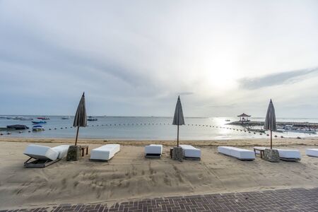 sea Beach with chair during sunset in bali , indonesiaの写真素材