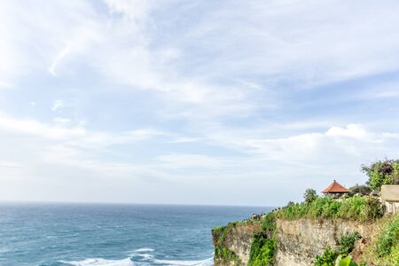 Uluwatu temple in the sea in Bali Indonesiaの写真素材