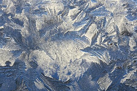 winter pattern of ice crystals on glass.の写真素材