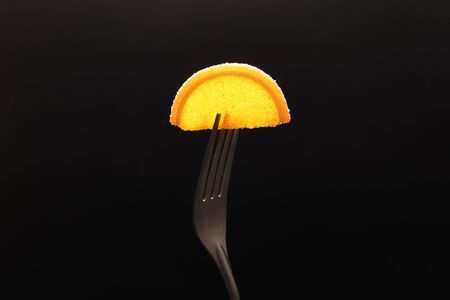 Sweet dessert. Slices of marmalade and jelly beans on a fork.