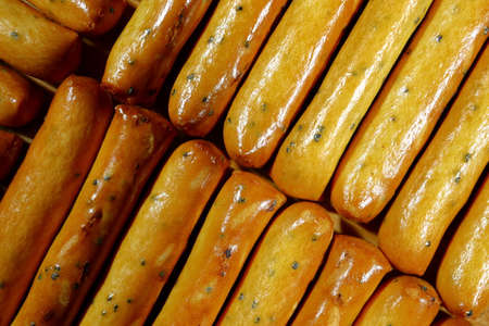 long cookies with poppy seeds close up.の写真素材