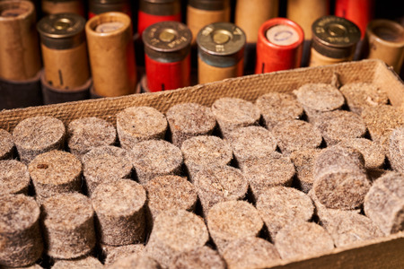 Hunting equipment for making cartridges on a wooden table.の写真素材