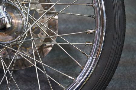 The front wheel of a modern motorcycle.