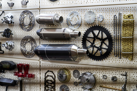 Motorcycle parts and accessories on the wall.の写真素材