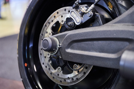 The rear wheel of a modern motorcycle.の写真素材