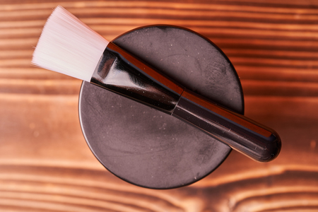 Makeup brush on wooden background. Products for cosmetic procedures.の写真素材
