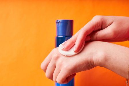 Moisturizer in the girl's hand. Skin care cosmetics.の写真素材