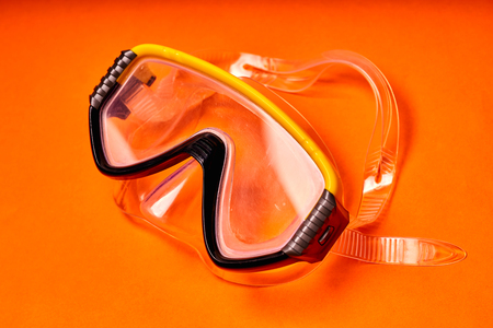 Mask for scuba diving on an orange background.の写真素材