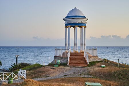 Rotunda on the ocean. Beautiful seascape with architectural structure.