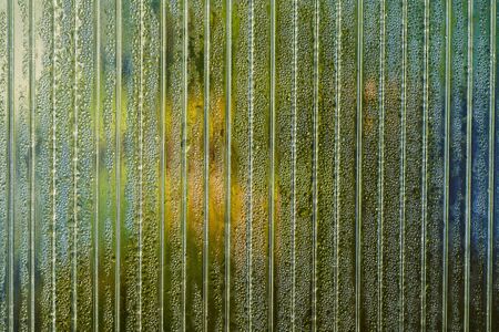 Transparent polycarbonate sheet with morning dew drops. Abstract background.の写真素材