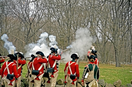 Concord, USA - April 16, 2011: British soldiers fight the Minute Man on Battle Road in Concord, MA during the Commemorating the Patriot Day.のeditorial素材