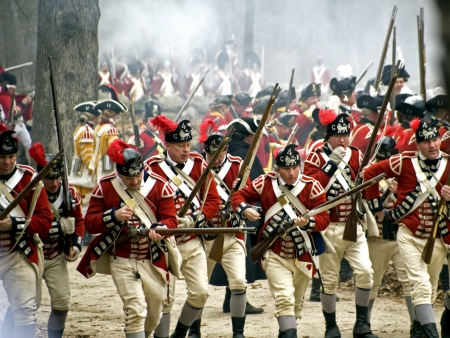 Concord, USA - April 16, 2011: British soldiers fight the Minute Man on Battle Road in Concord, MAのeditorial素材