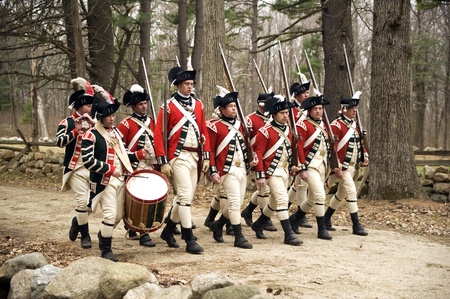 Concord, USA - April 16, 2011: British soldiers march on Battle Road in Concord, MA during the...