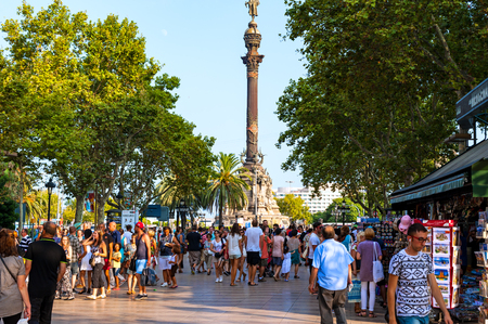 Barcelona, Spain - August 6, 2014: La Rambla street is very popular with tourists and locals.