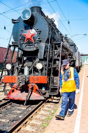 Irkutsk, Russia - August 30, 2016: a retro steam train takes tourists for a journey by the Circum-Baikal Railway, a historic rail road.のeditorial素材