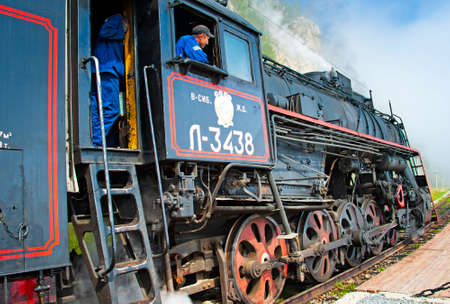 rkutsk, Russia - August 30, 2016: a retro steam train takes tourists for a journey by the Circum-Baikal Railway, a historic rail road. The Circum-Baikal is one of the picturesque sights of the area arのeditorial素材