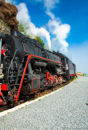 Irkutsk, Russia - August 30, 2016: a retro steam train takes tourists for a journey by the Circum-Baikal Railway, a historic rail road.のeditorial素材