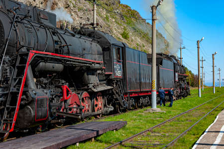 Irkutsk, Russia - August 30, 2016: a retro steam train takes tourists for a journey by the Circum-Baikal Railway, a historic rail road.のeditorial素材