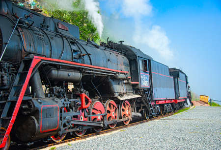 Irkutsk, Russia - August 30, 2016: a retro steam train takes tourists for a journey by the Circum-Baikal Railway, a historic rail road. The Circum-Baikal is one of the picturesque sights of the area aのeditorial素材