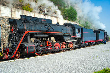 Irkutsk, Russia - August 30, 2016: a retro steam train takes tourists for a journey by the Circum-Baikal Railway, a historic rail road. The Circum-Baikal is one of the picturesque sights of the area aのeditorial素材