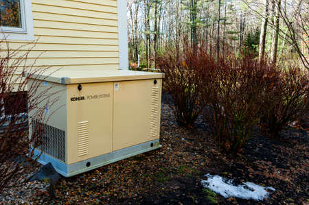 Newbury, USA - February 24, 2017: Residential standby generator installed at the house wallのeditorial素材