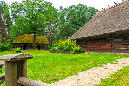 Old Latvian wooden houses represent architectural style  of the country regions.のeditorial素材