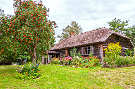 Old Latvian wooden house which represents architectural style  of the country regions.のeditorial素材