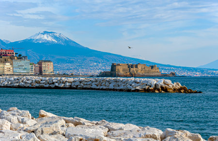 Naples, Italy - January 21, 2017: People strolling the Lungomare Caracciolo,  romantic seaside promenade with views of Naples, castles & Mt. Vesuviusのeditorial素材