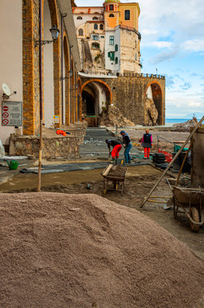 Atrani, Italy - January 19, 2017: workers are installing new pavers walks in a small coastal town of Atrani, just a short drive away from Amalfiのeditorial素材
