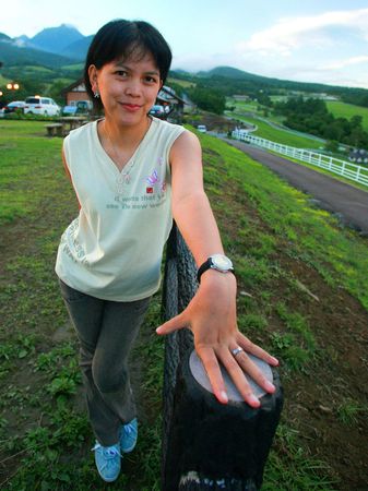 A shy asian woman with a beautiful handの写真素材