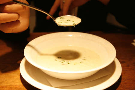 an asian woman with a bowl of tasty italian soupの写真素材