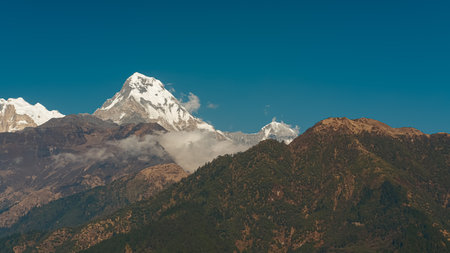 GHOREPANI, NEPAL - JANUARY 9, 2025: Beautiful evening view of the Annapurna mountain range from Ghorepani village.の写真素材
